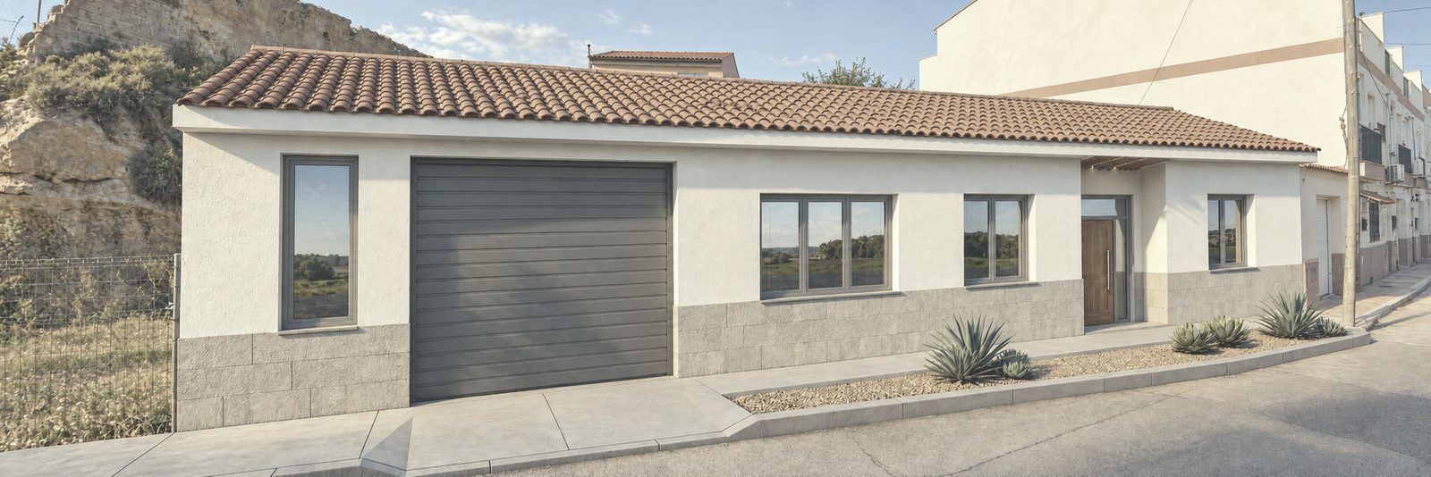 Fotomontaje de la fachada a la calle: vivienda de una planta con garaje, zócalo de piedra y jardín seco